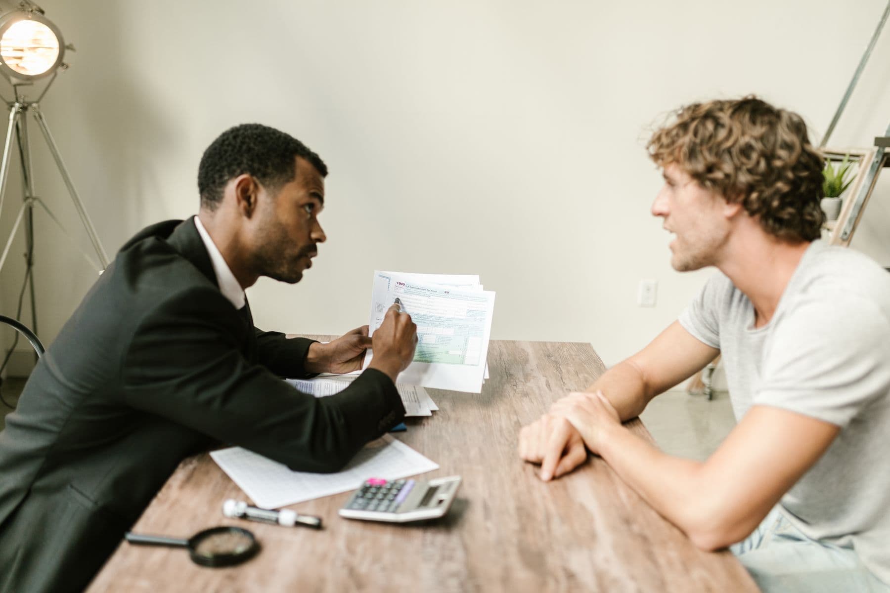 Business professionals reviewing financial records in a modern office