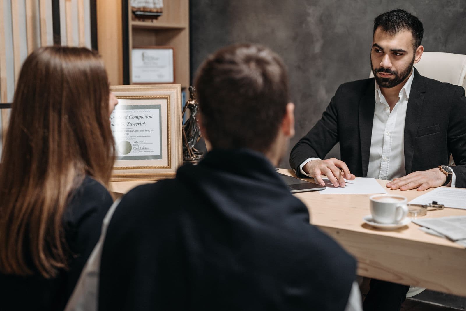 Law firm professionals reviewing financial records