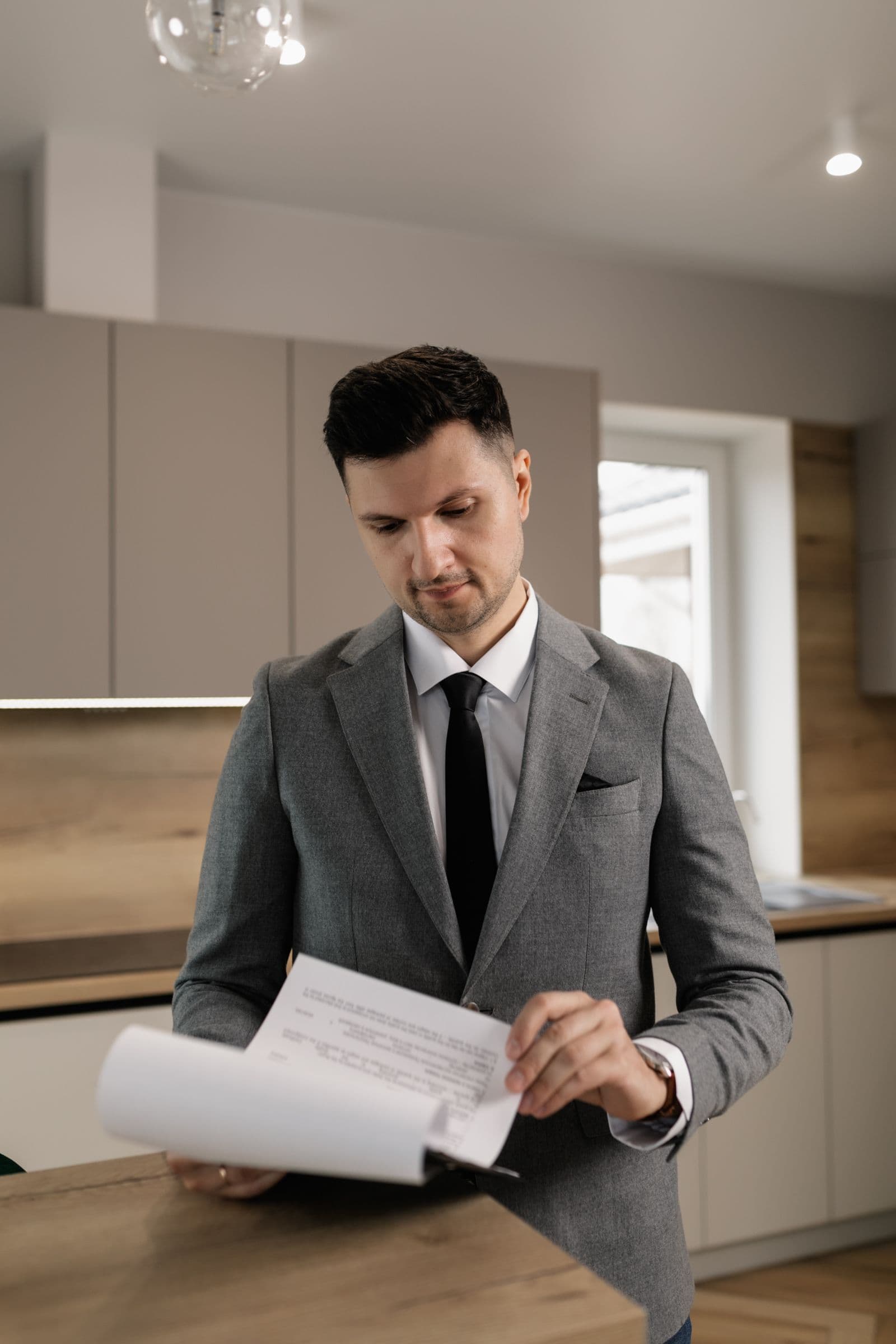 Real estate agent and client reviewing transaction documents