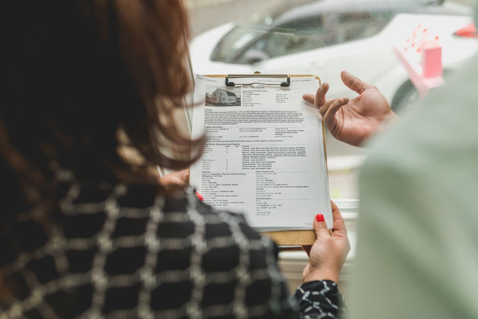 Real estate professional reviewing transaction records
