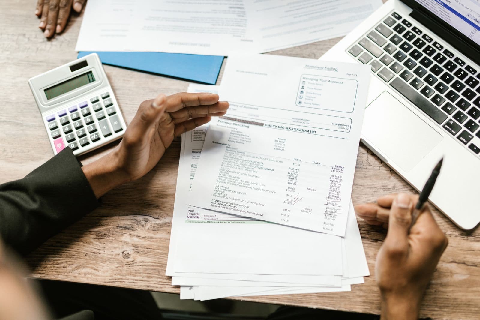 Business professionals reviewing financial records and reports