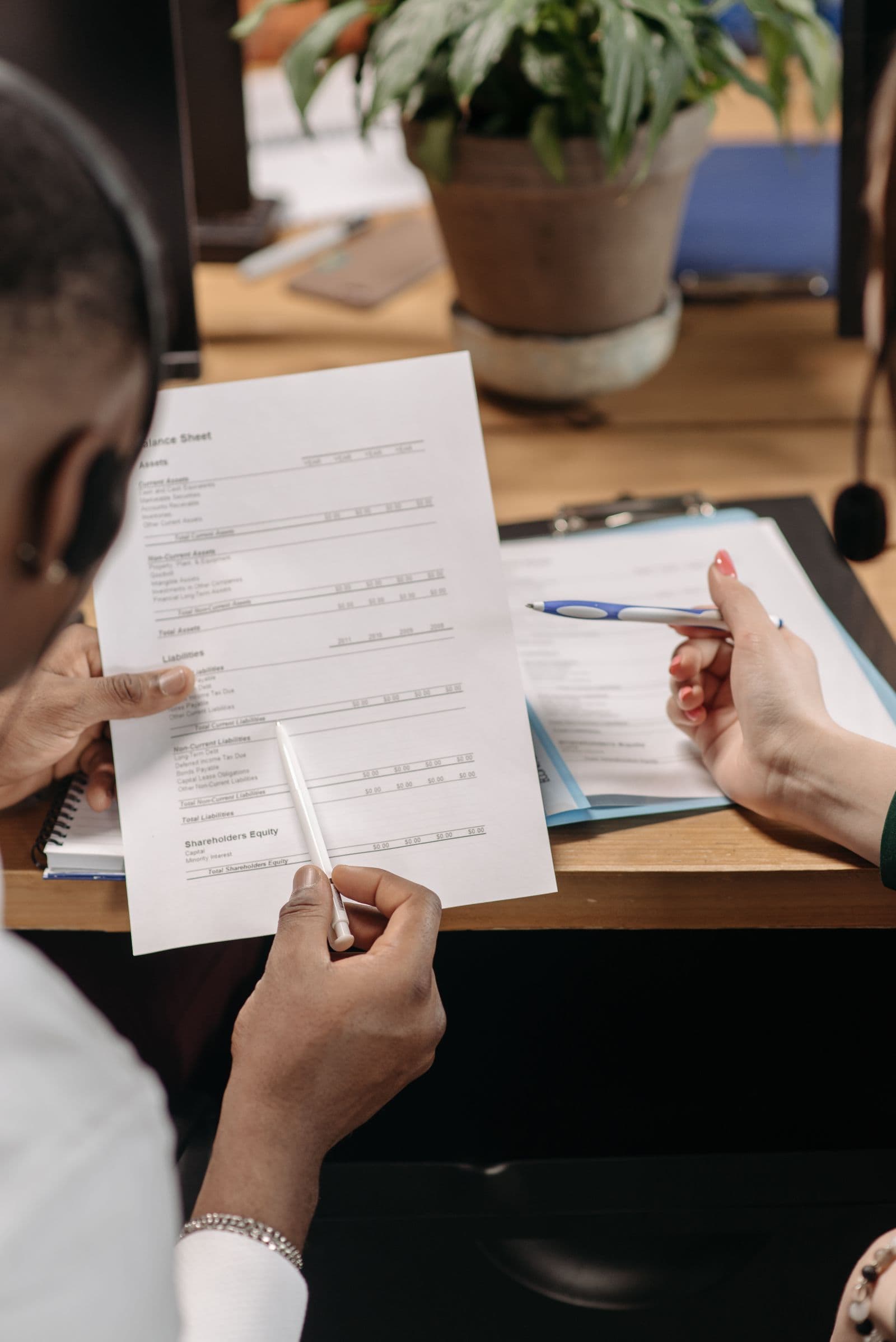 Business team reviewing financial reports and bookkeeping records