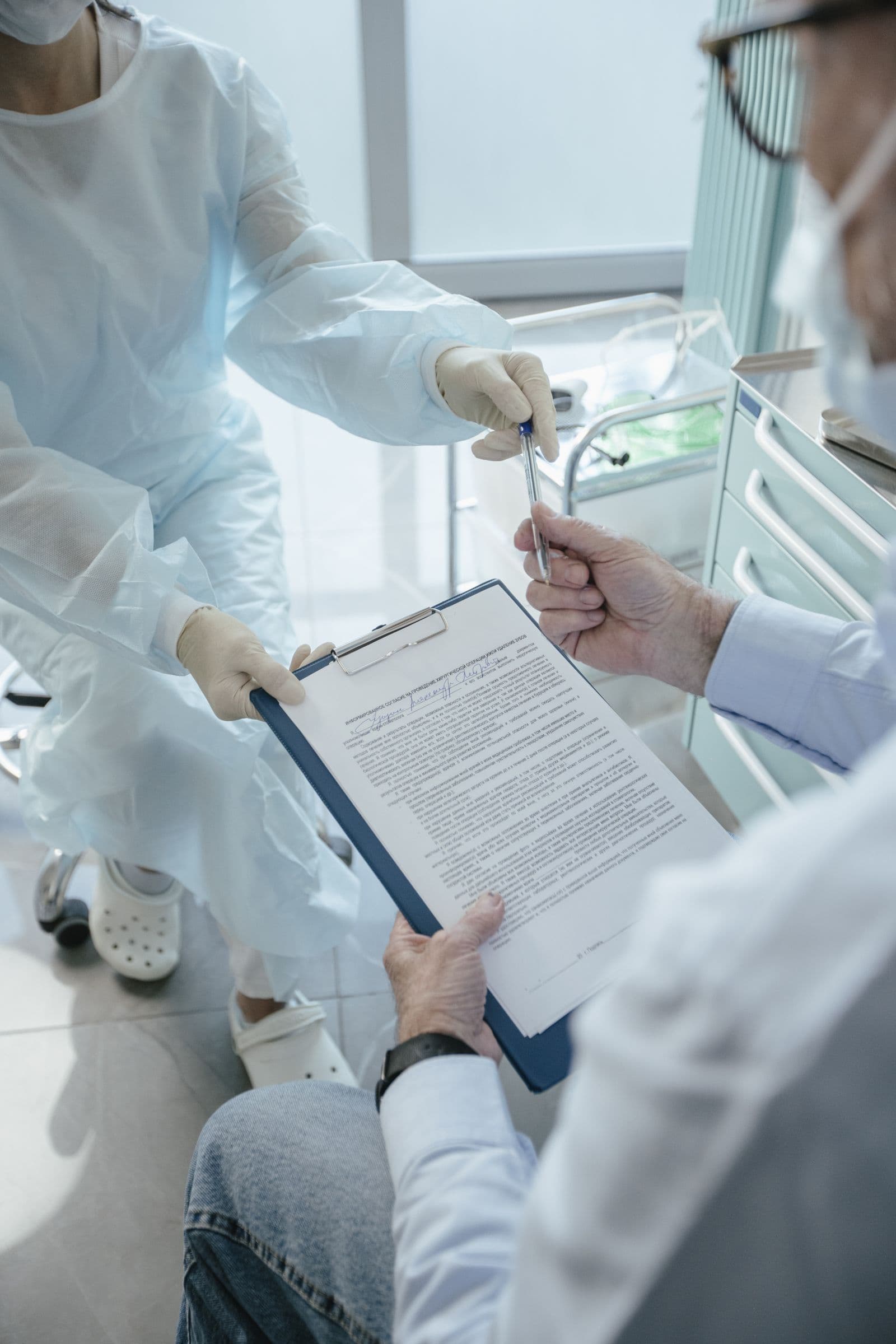 Medical professionals reviewing administrative and financial records in a clinic