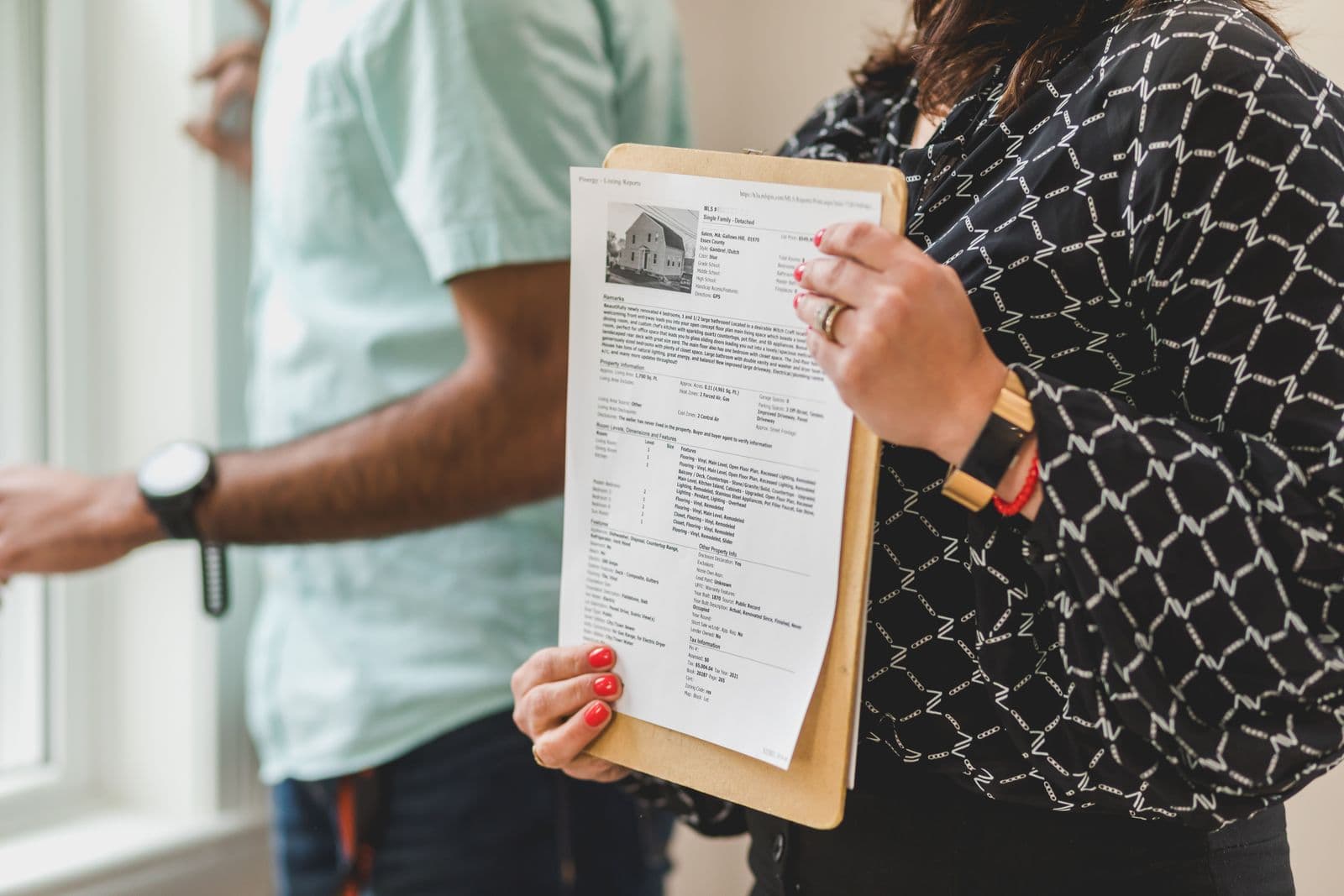 Real estate professional reviewing property transaction documents
