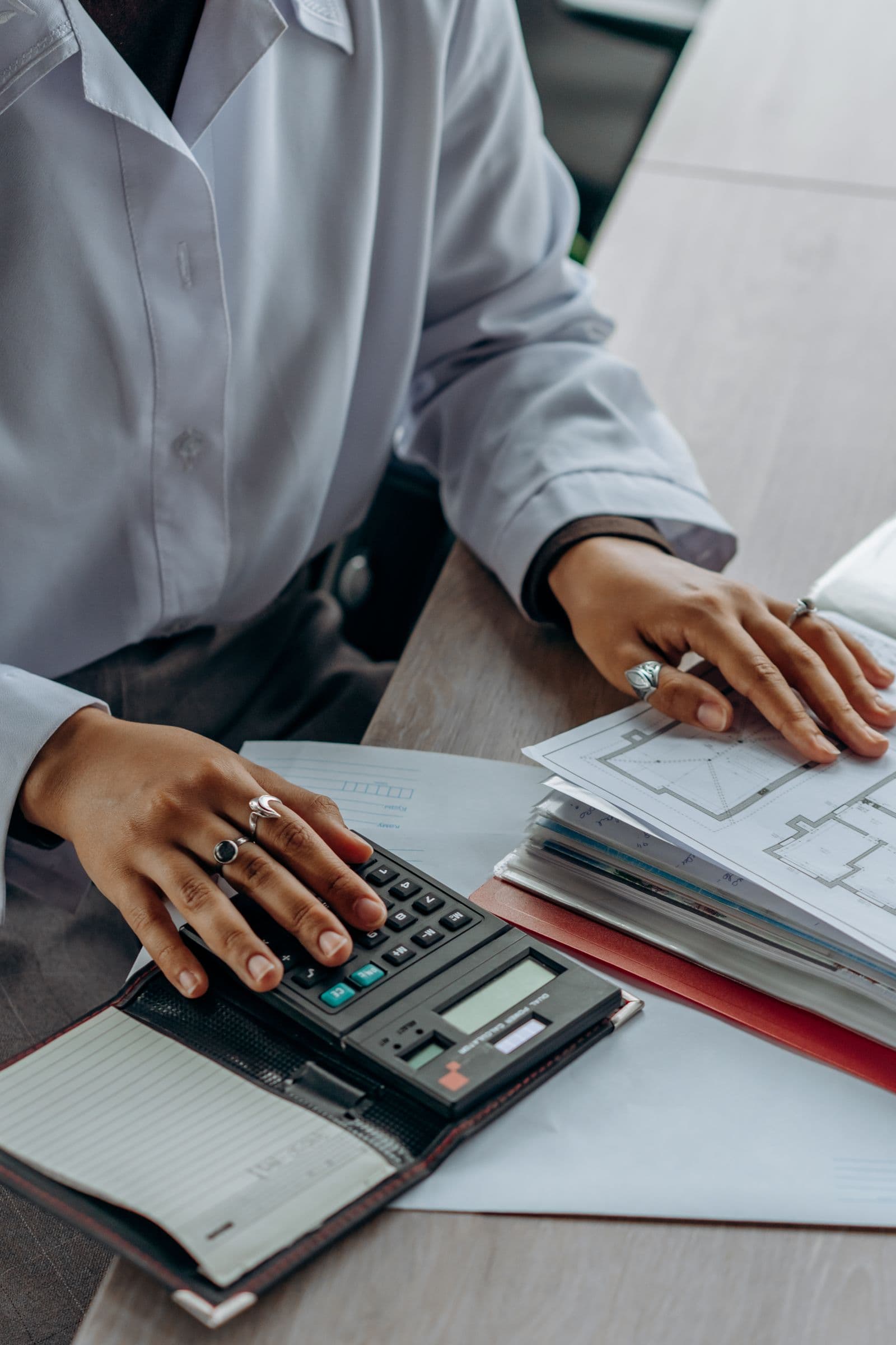 Financial records being reviewed with a calculator before a CRA response