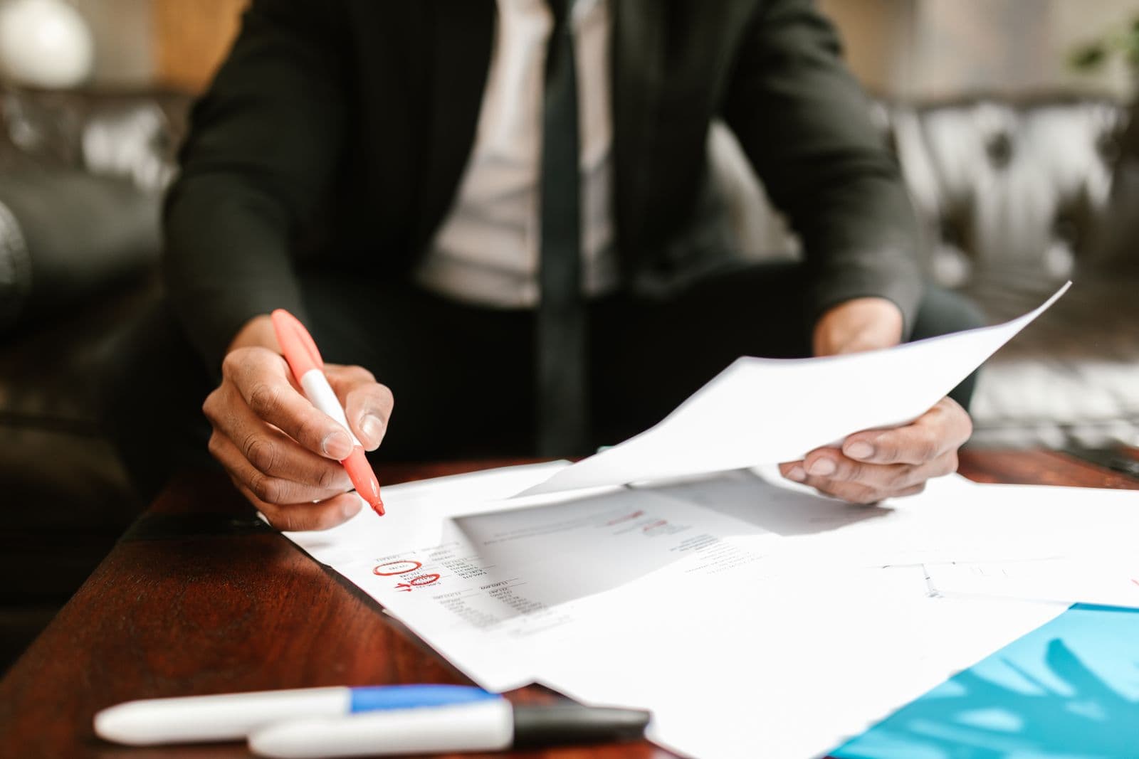 Business owner reviewing organized financial records and bookkeeping documents
